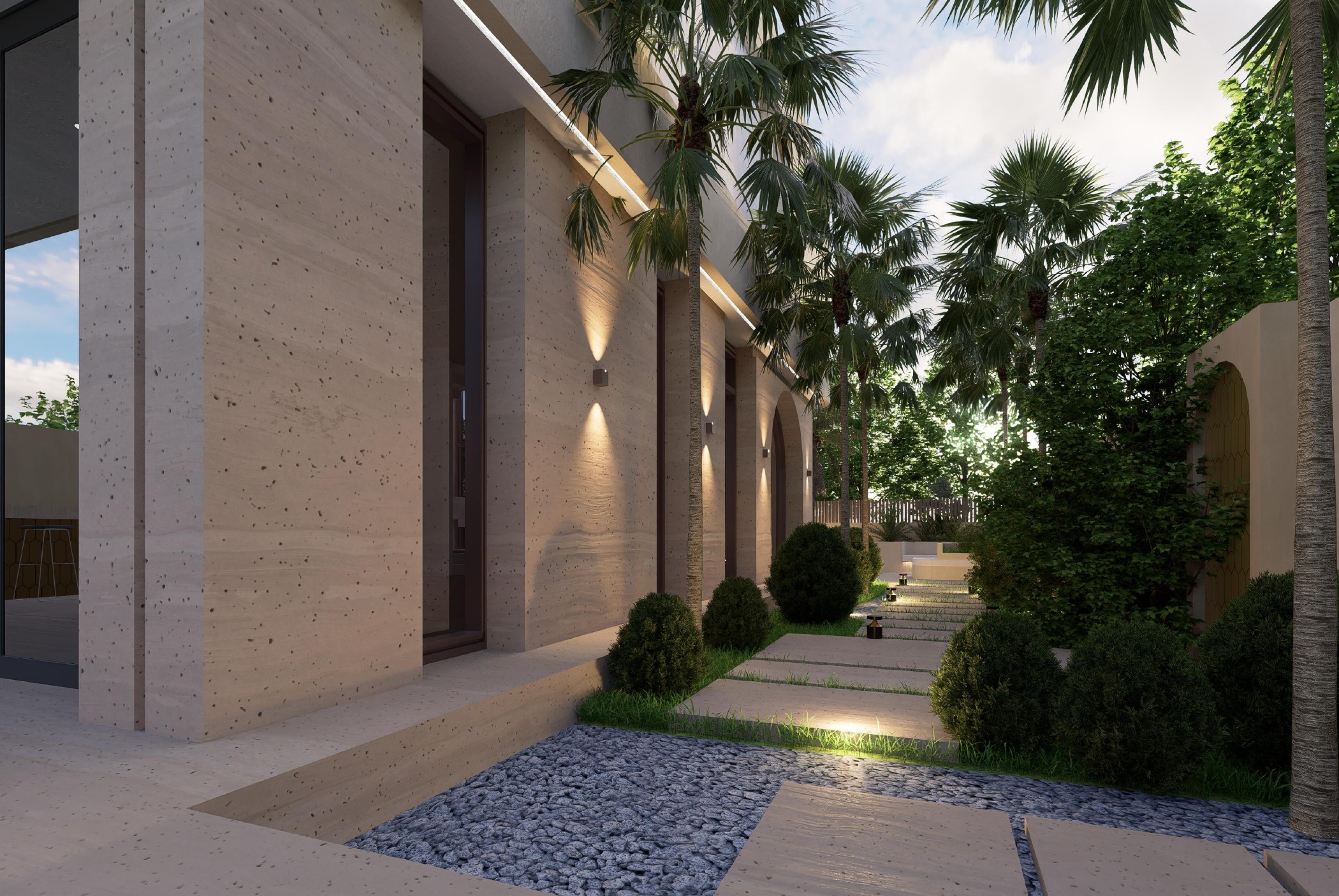 Couloir entrée Villa Bali Marrakech, mur travertin griffé et allée pierre avec palmiers